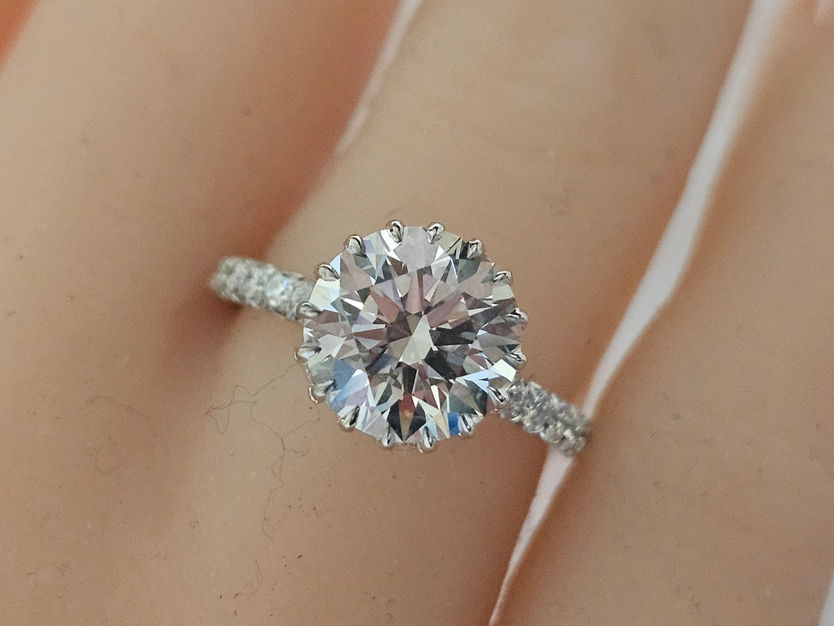 Solitaire 3.52Ct Center w/ Custom Cut Baguettes Wrapped Around Under the Crown w/ 1.87Ct Side Diamonds in 14Kt White Gold