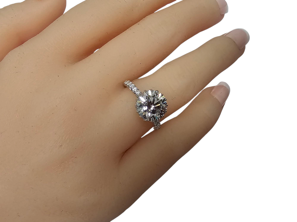Solitaire 3.52Ct Center w/ Custom Cut Baguettes Wrapped Around Under the Crown w/ 1.87Ct Side Diamonds in 14Kt White Gold