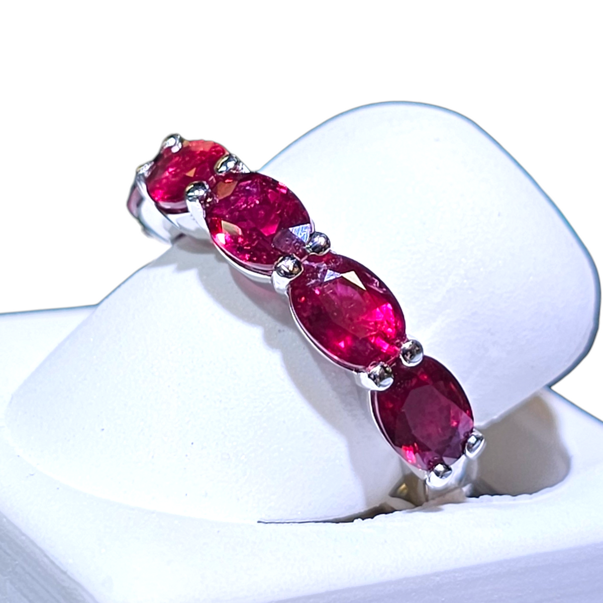 18Kt White Gold Oval Ruby Half Eternity Band